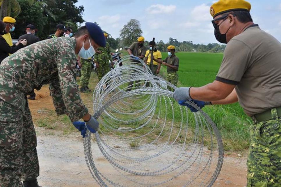 Колючий дріт проти Covid-19 в Малайзії